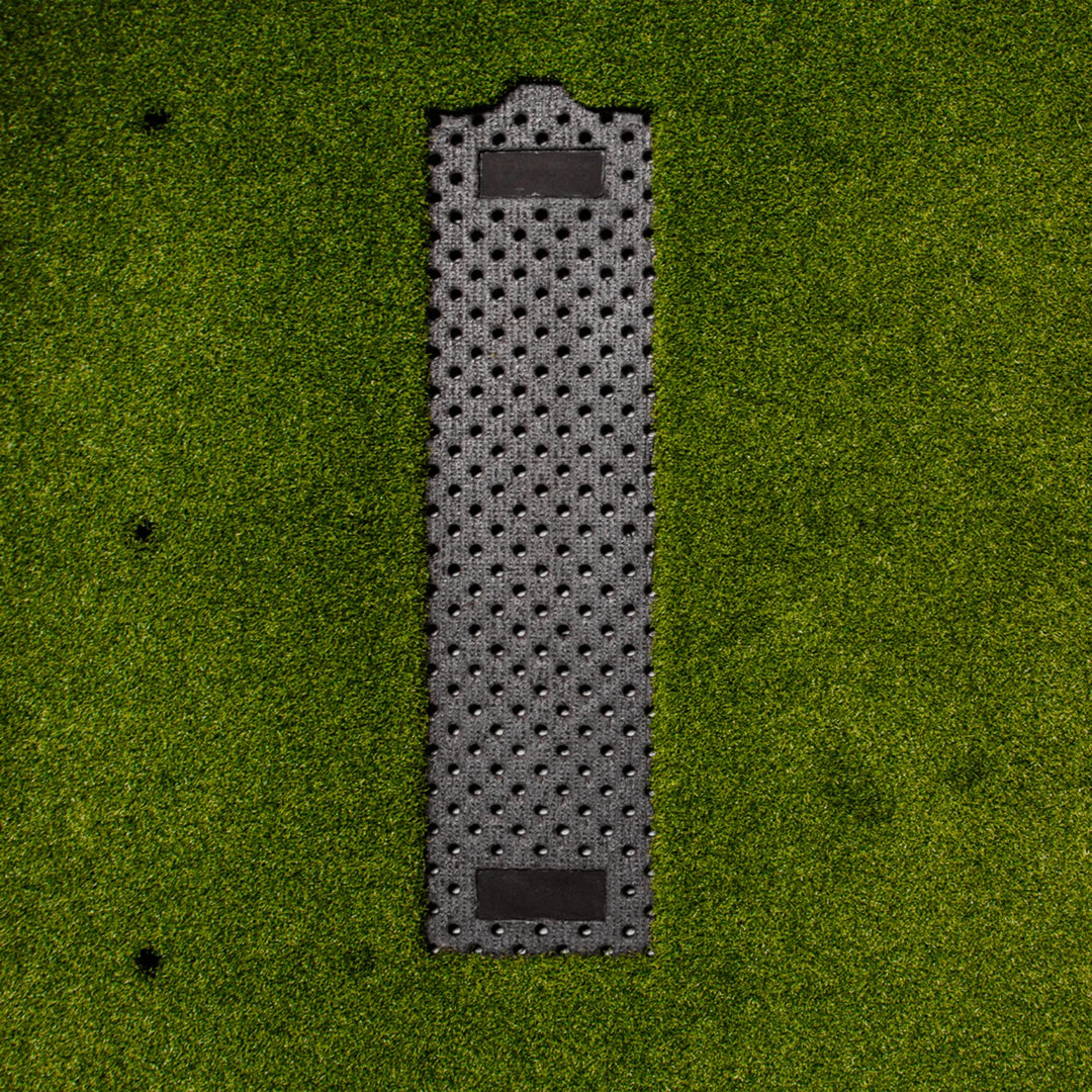 Close-up of the recessed perforated tray in the Divot Board Turf Mat, where the Divot Board seats flush